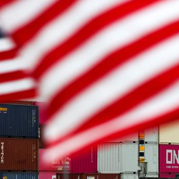 US flags flutter in front of shipping containers at the Port of Long Beach in Long Beach, California. Photo taken on July 11, 2025. 