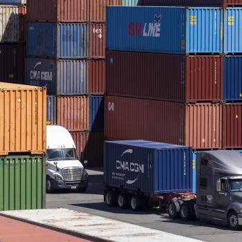 Trucks carry shipping containers to be unloaded and stacked in the Port of Seattle in Seattle, Washington. Photo taken on August 11, 2025. 