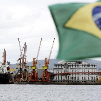Cargo ships are loaded with containers at a port near Sao Paulo, Brazil. 