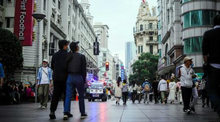 Pedestrians on a street in Shanghai, China. Picture taken on October 16, 2022. 
