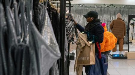 A woman shops at a store in Times Squares in New York City, U.S. 