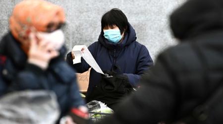A woman looks over her grocery bill as consumer prices surged 7% over a year as inflation hits 40-year high. New York City, NY, January 13, 2022. 