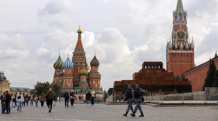 People walk across Red Square near St. Basil's Cathedral and the Kremlin's Spasskaya Tower in central Moscow, Russia September 21, 2022. 