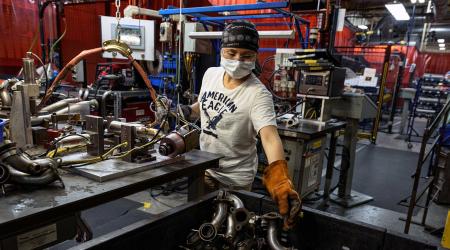 A welder works at a manufacturing and assembly plant in Roseau, Minnesota, U.S. June 7, 2021. 
