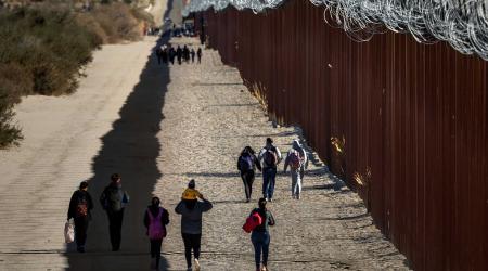 Asylum seekers cross the border with Mexico in San Diego, California. Picture taken on November 28, 2023. 