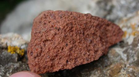 Reddish-brown bauxite is shown in this photo illustration. 