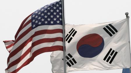 Flags of the US and South Korea flap in the wind in Seoul May 26, 2009. 