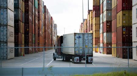 An eighteen-wheeler is seen entering one of the main shipping container corridors in Houston, Texas. 