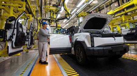 Employees work on the production line at a factory for electric vehicles (EV) in Wuhu, Anhui province, China July 29, 2024. 