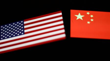 Flags of United States and China are shown in this photo illustration. NurPhoto/Jakub Porzycki