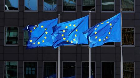 European Union flags flutter outside the European Commission headquarters in Brussels, Belgium. 