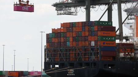 A docked cargo ship is loaded with shipping containers at Port Elizabeth, New Jersey, US, July 12, 2023. 