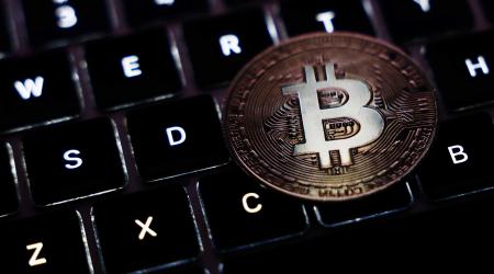 A laptop keyboard and representation of cryptocurrency is shown in this photo illustration, following Trump’s appearance at the Bitcoin 2024 event in Nashville, TN. 