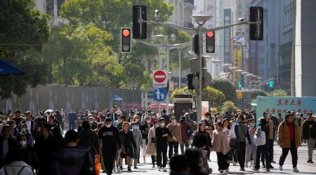 People walk at the main shopping area in Shanghai, China, March 14, 2023. 
