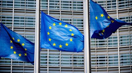 European Union flags fly outside the European Commission headquarters in Brussels, Belgium, March 1, 2023. 