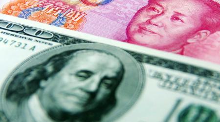Illustration of US dollar and RMB yuan banknotes.