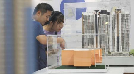 People visit the sales exhibition of Home Ownership Scheme at Lok Fu Housing Authority Customer Service Centre. 