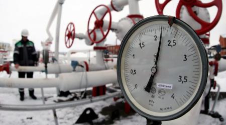 A worker inspects valves and pipes at an oil gathering station near Ufa Russia. 