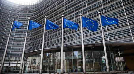 European Union flags are seen in front of the European Commission building in Brussels, Belgium. 