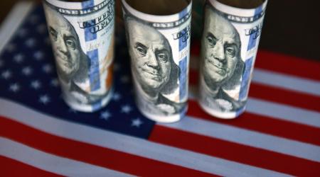 Photo illustration shows US currency. 