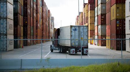 An eighteen-wheeler is seen entering one of the main shipping container corridors in Houston, Texas. 