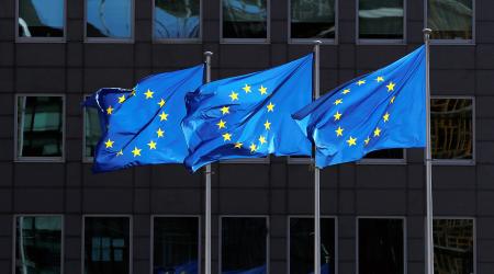 European Union flags flutter outside the European Commission headquarters in Brussels, Belgium.