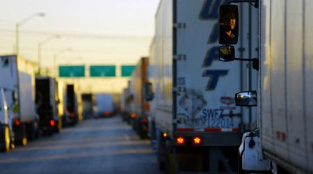 Trucks wait in a queue to cross into the US. Picture taken April 14, 2023. 