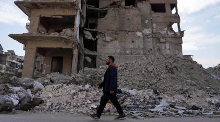 A man walks past a damaged building in Aleppo, Syria. Photo taken on January 25, 2025. 