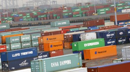 Shipping containers stand stacked at a port in Newark, New Jersey. 