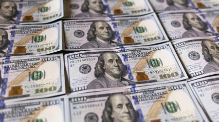 US currency is displayed in this photo illustration. 