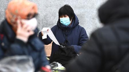 A woman looks over her grocery bill as consumer prices surged 7% as inflation hits 40-year high in Queens, NY. Picture taken on January 13, 2022. 