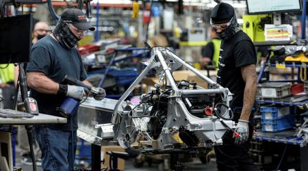 People work on an assembly line at a manufacturing and assembly plant in Roseau, Minnesota. Picture taken on June 7, 2021.