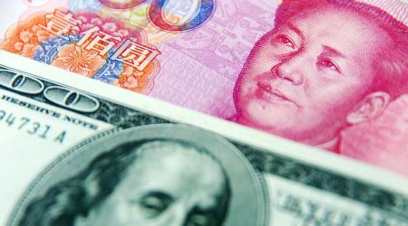 Photo of the US dollar and RMB yuan banknotes. 