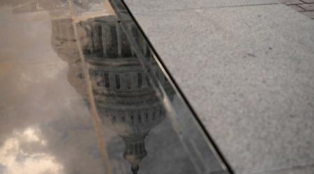 The U.S. Capitol is reflected on a window as members of the House Budget Committee are set to meet in a rare Sunday night session to consider U.S. President Donald Trump's sweeping tax-cut bill, on Capitol Hill in Washington, D.C., U.S., May 18, 2025. 