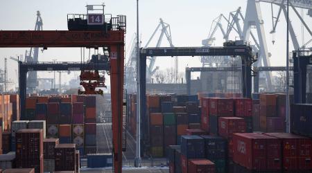 Stacks of shipping containers are pictured at a busy port in Europe. February 22, 2025. 