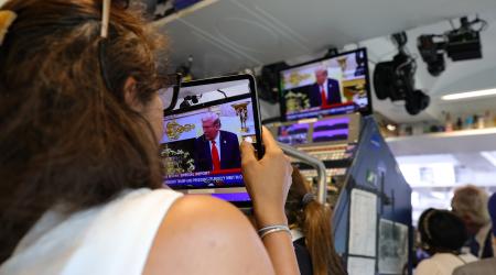 Members of the press watch from the James S. Brady Press Briefing Room at the White House, as President Donald Trump meets with President Volodymyr Zelensky in Washington, DC on August 18, 2025. 