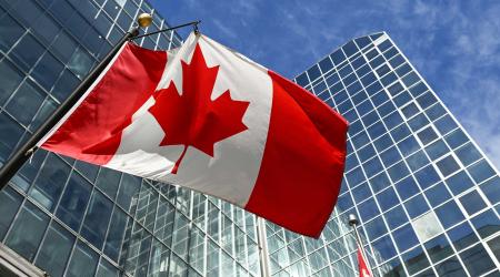 Canadian national flag flies outside government offices in downtown Ottawa, Ontario, Canada. Photo taken on March 8, 2025. 