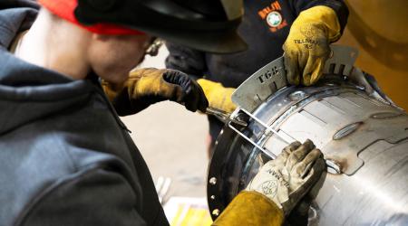 Workers prepare to weld a steel tube at a factory in Mendota, Illinois. Picture taken on February 21, 2025. 