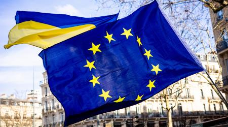 Demonstrators hold the EU and Ukrainian flags on the eve of the third anniversary of the start of Russia's invasion of Ukraine, in Paris, France. Photo taken on February 23, 2025.