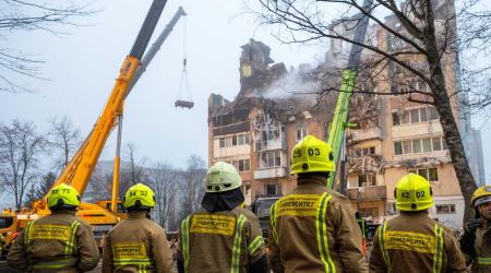 Students preparing to be firefighters gather in front of an apartment building that was hit by a Russian missile, amid Russia's attack on Ukraine, in Ternopil, Ukraine. Photo taken on November 20, 2025. 
