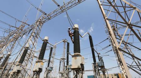 A technician works on power supply lines in the western Indian state of Gujarat. 