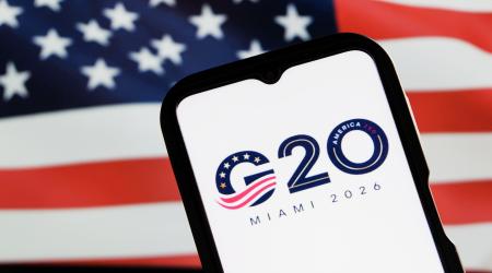 The 2026 G20 Miami Summit logo is shown with the US flag in this photo illustration. 