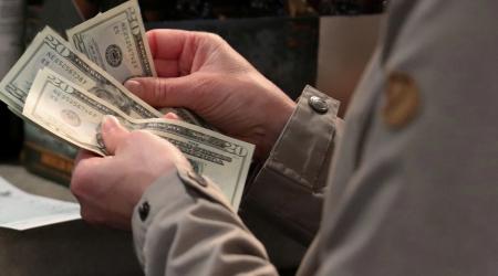Customer paying with cash in Washington, DC.