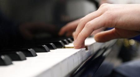 A piano is being played at a music store in Wisconsin. 