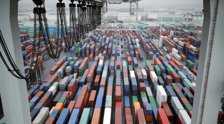 Shipping containers sit stacked at the port terminal in Le Havre, France. 