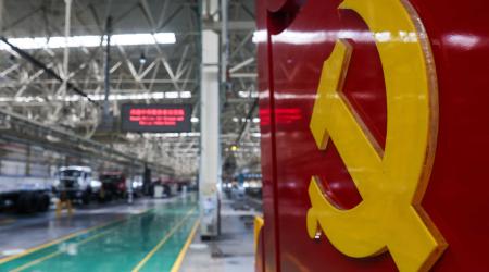 Symbols of the Chinese Communist Party are displayed at a truck factory during an organized media tour in Baotou, China. Photo taken on June 13, 2026. 