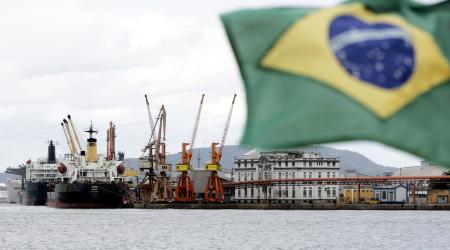 Cargo ships are loaded with containers at a port near Sao Paulo, Brazil. 