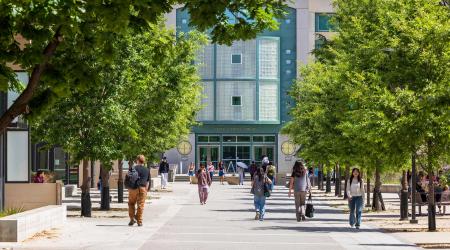 University students walk in front of the Peter J. Shields Library on the campus of the University of California, Davis. April 2025. 