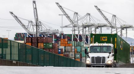 Shipping containers await to be unloaded at the port of Oakland in California. May 2025.