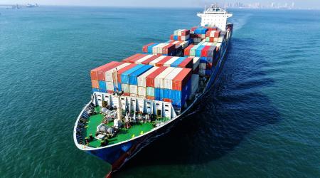 A Chinese cargo ship loaded with foreign trade containers is en route from Shandong Province, China. July 2026. 